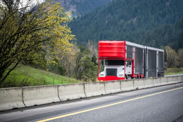 Powerful,White,Big,Rig,Car,Hauler,Semi,Truck,With,Covered Powerful white big rig car hauler semi truck with covered protected red semi trailer with black tent sides for luxury and exotic cars transportation running on the highway road in Columbia Gorge
